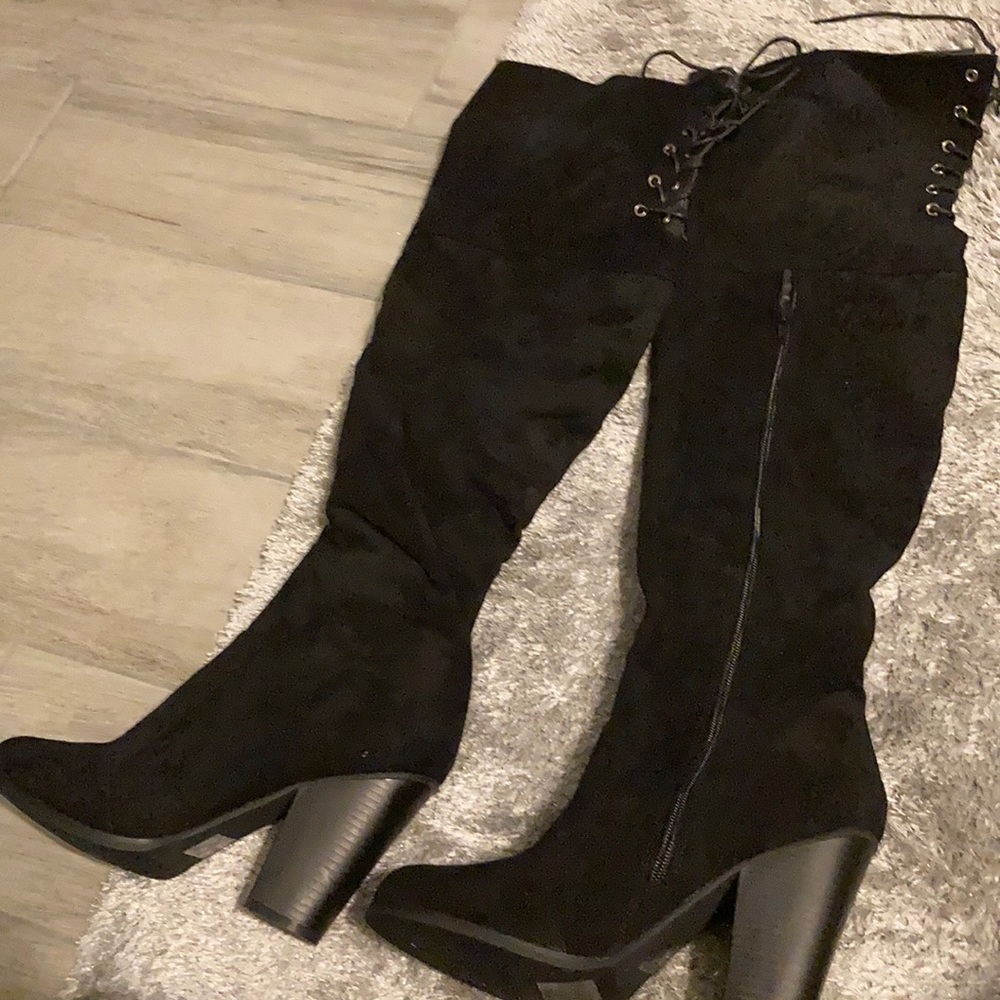 Black thigh high swayed boots